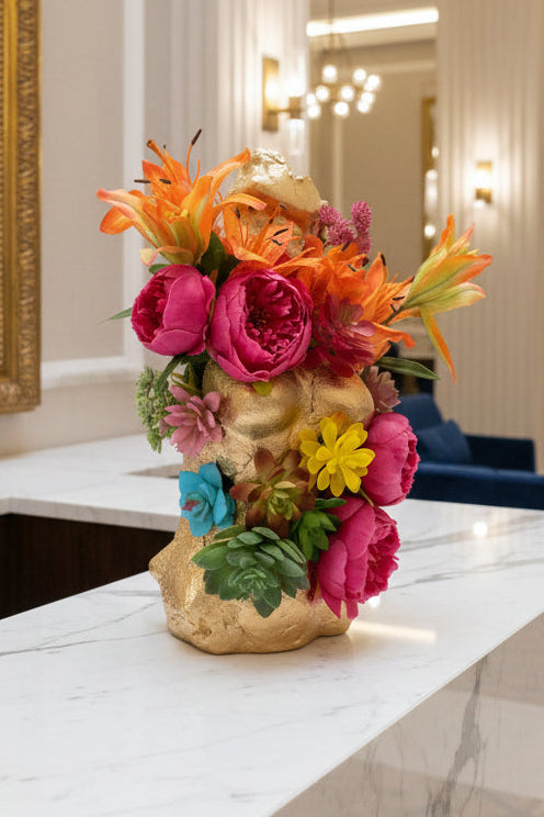 Broken Statue with Blooming Flowers