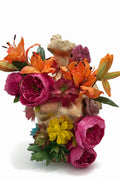 Broken Statue with Blooming Flowers